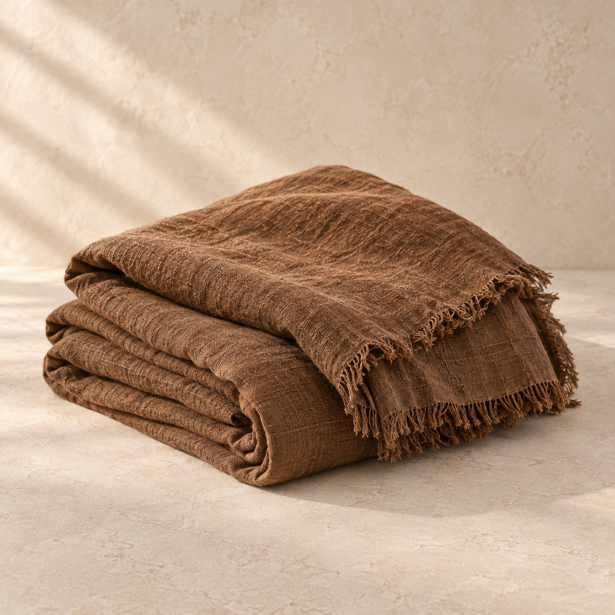Washed linen throw in tobacco